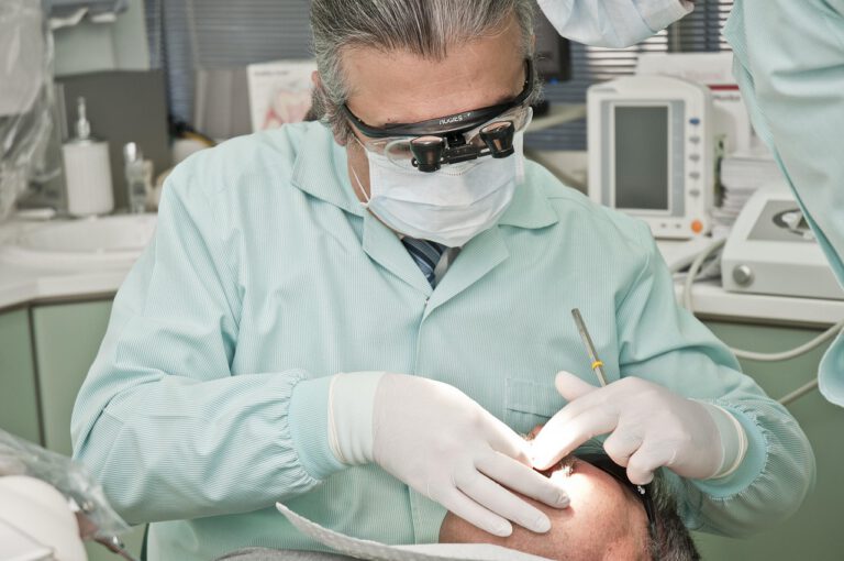 A dentist performs a dental procedure using magnifying loupes to ensure precision at Horizon Dental Kamloops